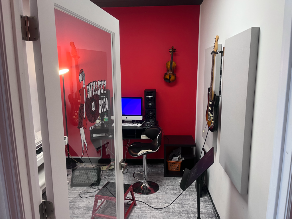 Room of music equipment and a macbook